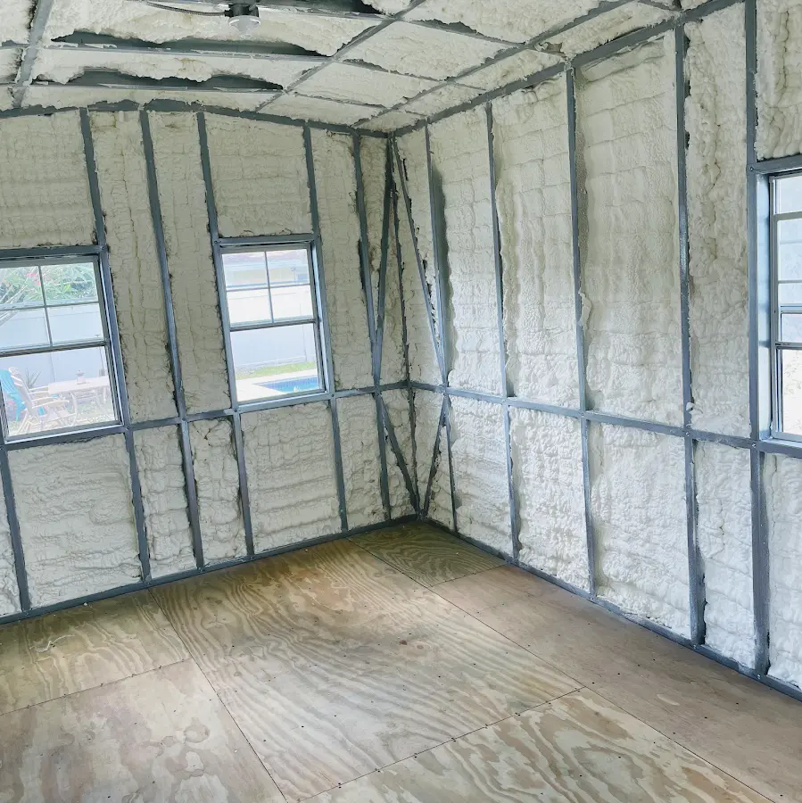 Closed-cell spray foam insulation applied to wall cavities in a residential project in Sheboygan Falls
